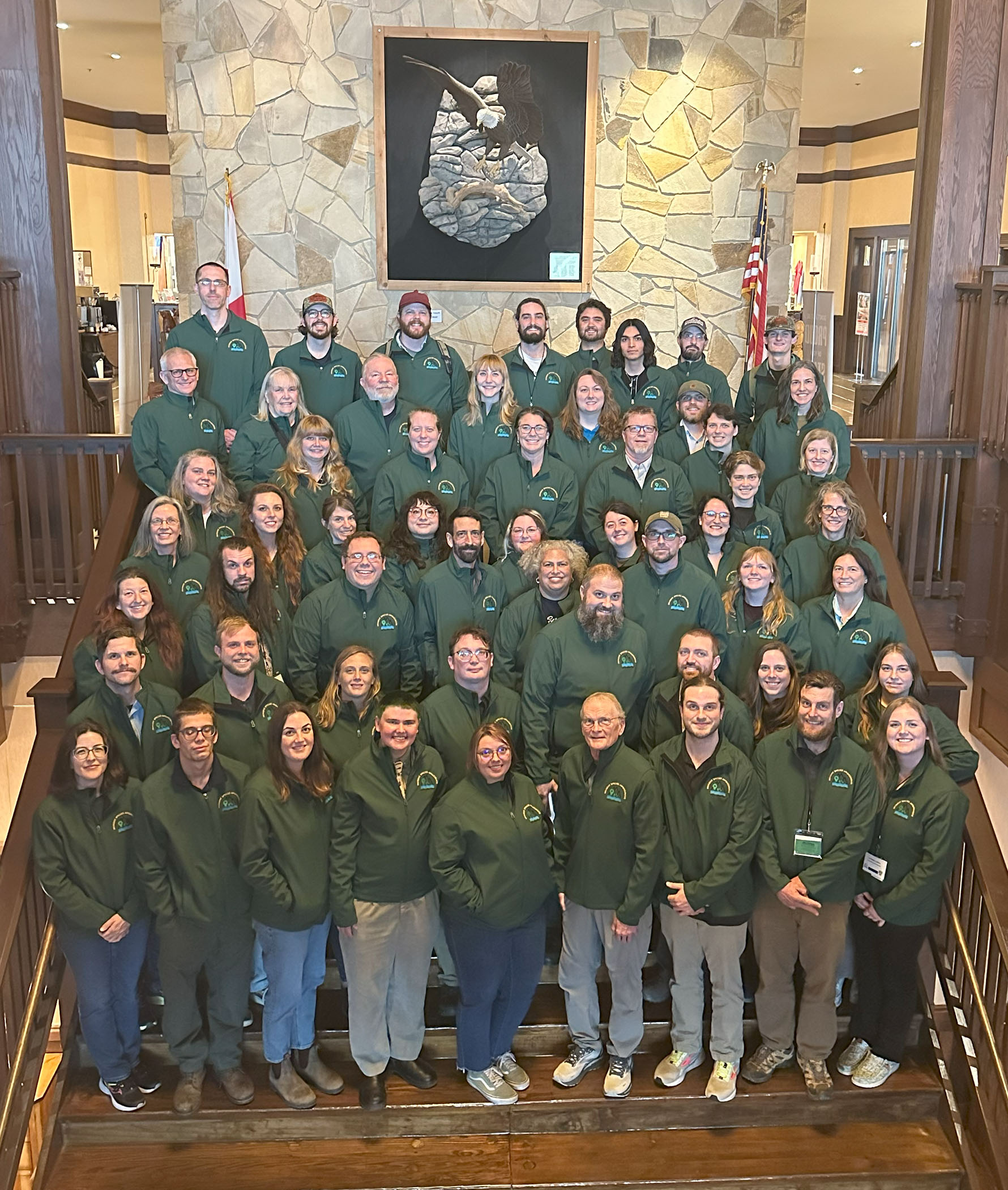 A group photo of 58 people who represent the Wild Spotter Invasive Species Ambassador Class of 2025.